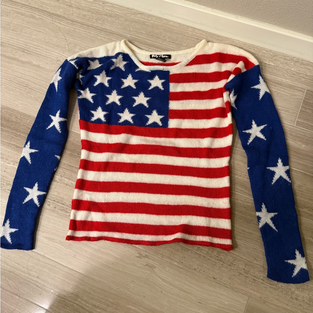 Red and White Striped Sweater with Blue Star Sleeves
